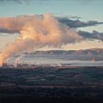 Panorama of Grangemouth petrochemical works and big cloud of smoke. Refinery from the Bathgate Hills. The Avon Viaduct. The Firth of Forth. Grangemouth, Scotland